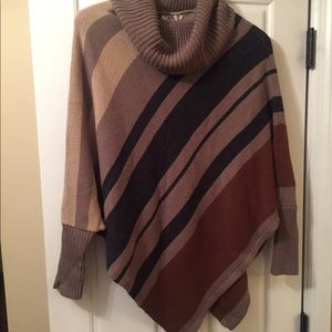 Sweater/poncho with armholes